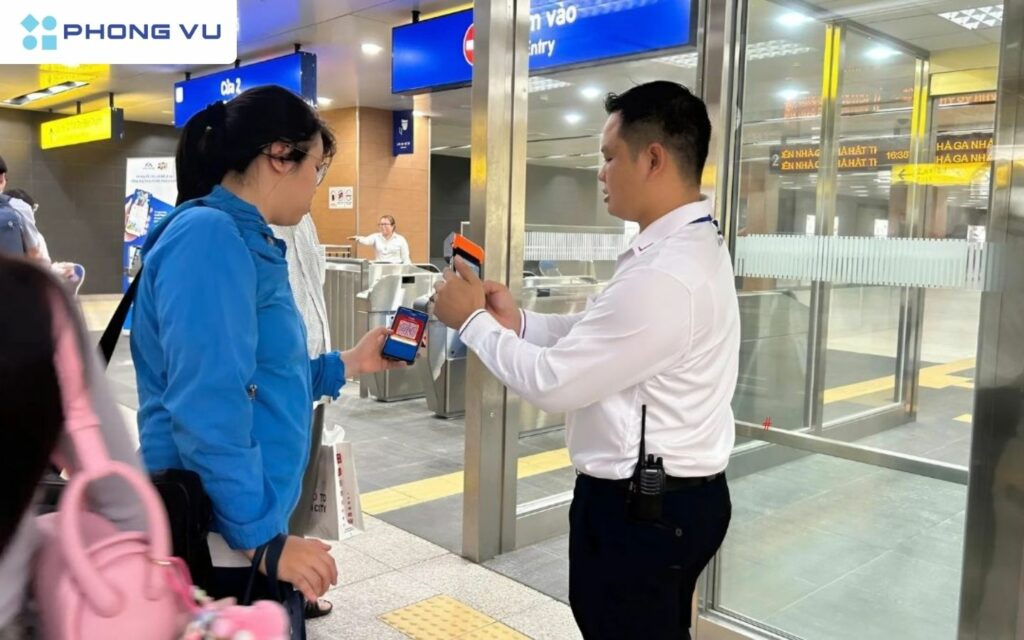 Scanning a QR-code ticket to pass the fare gate